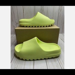 I am selling my pair of Yeezy slides in the “Glow green” color way.